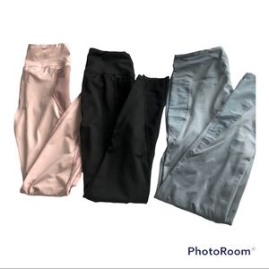I am selling three sports leggings that are pink, black and blue
